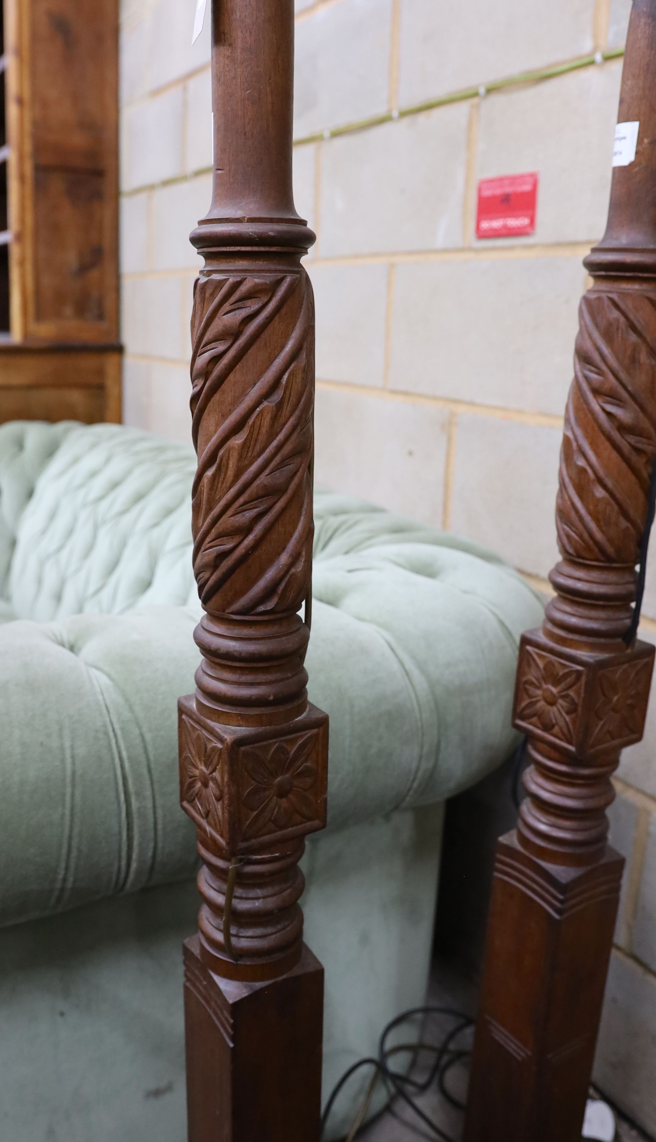 A pair of carved mahogany lamp standards, height 137cm